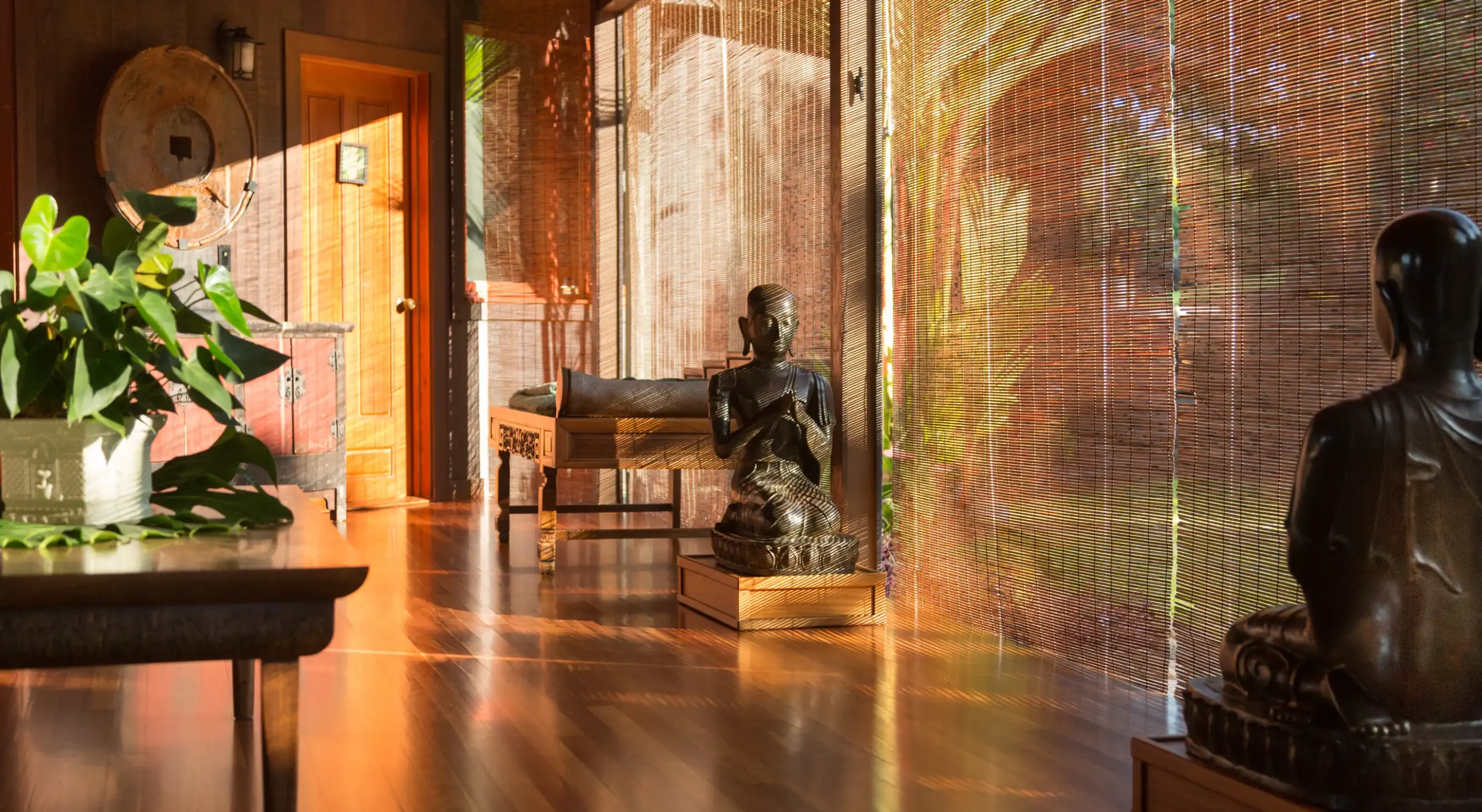Zen-inspired sitting room with floor-to-ceiling bamboo screens and garden views