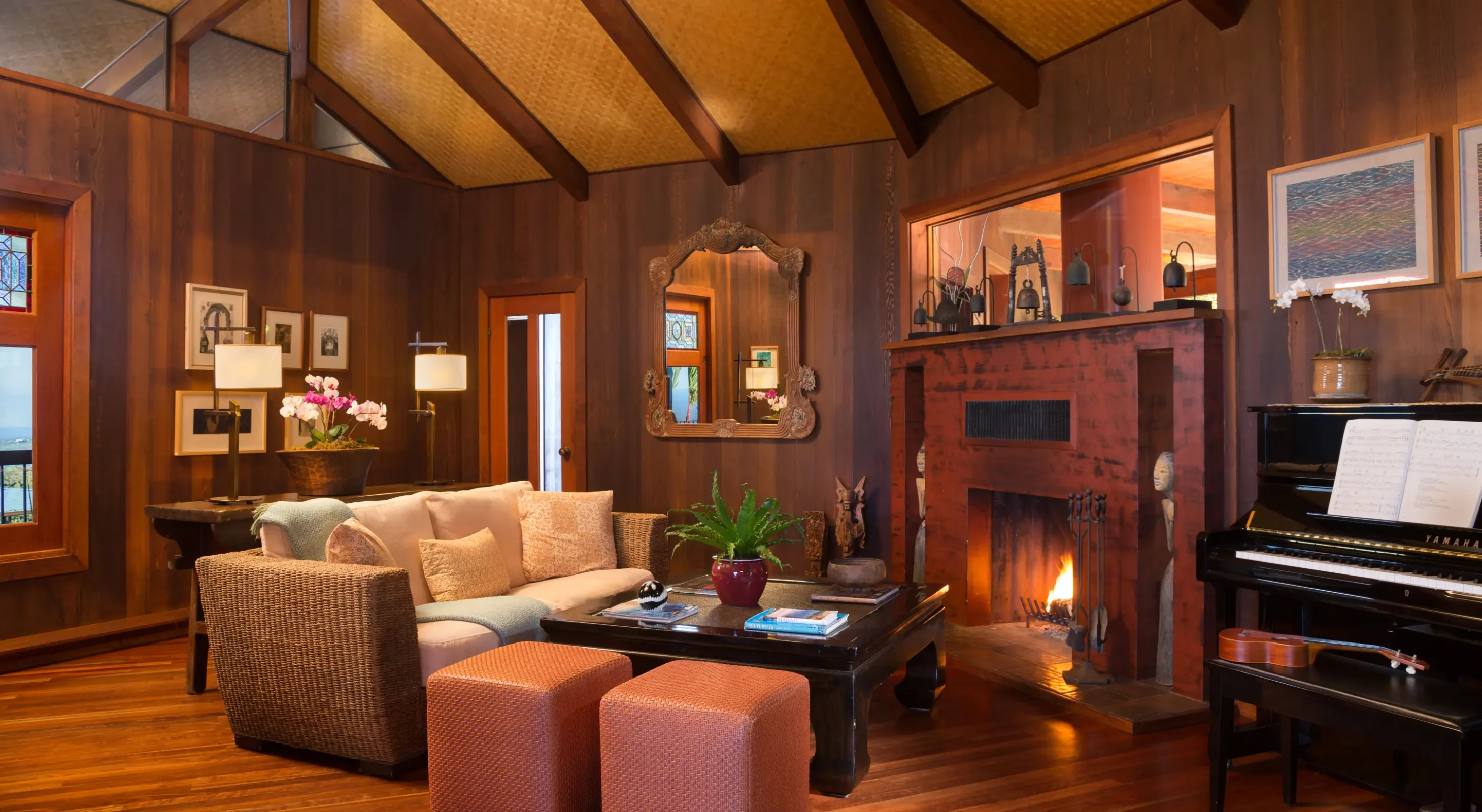 Great room interior with fireplace, piano, and cozy seating